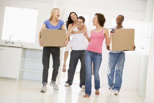 Removal van and moving boxes in a Goodmayes residential street