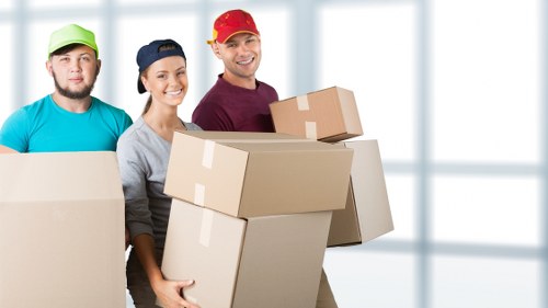 Careful unpacking of household items in a Goodmayes property after a move
