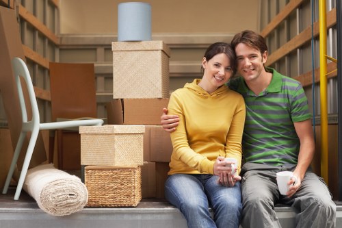 Professional movers handling household furniture in Goodmayes