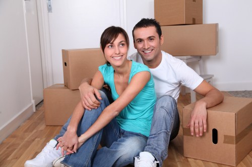 Loading household furniture into a removal truck in Goodmayes