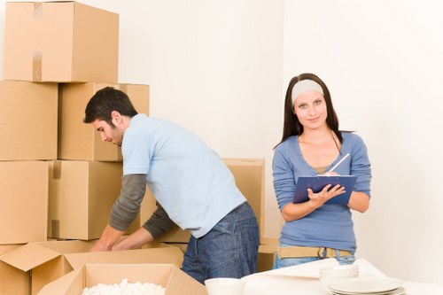 Furniture and boxes being loaded into a removals van in Goodmayes