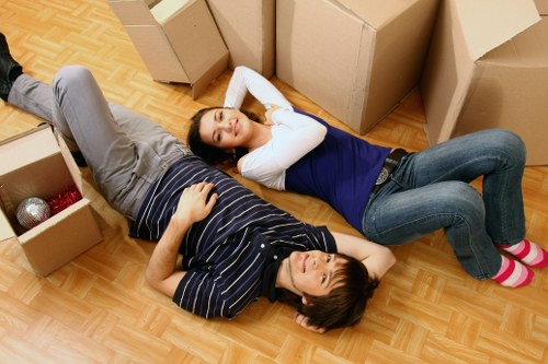 Removal team loading items from a flat with access challenges