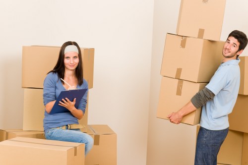 Commercial moving team preparing furniture and boxes for transport